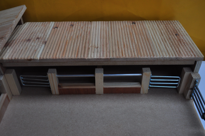 Millwood wooden cattle shed with metal accents on a plain background