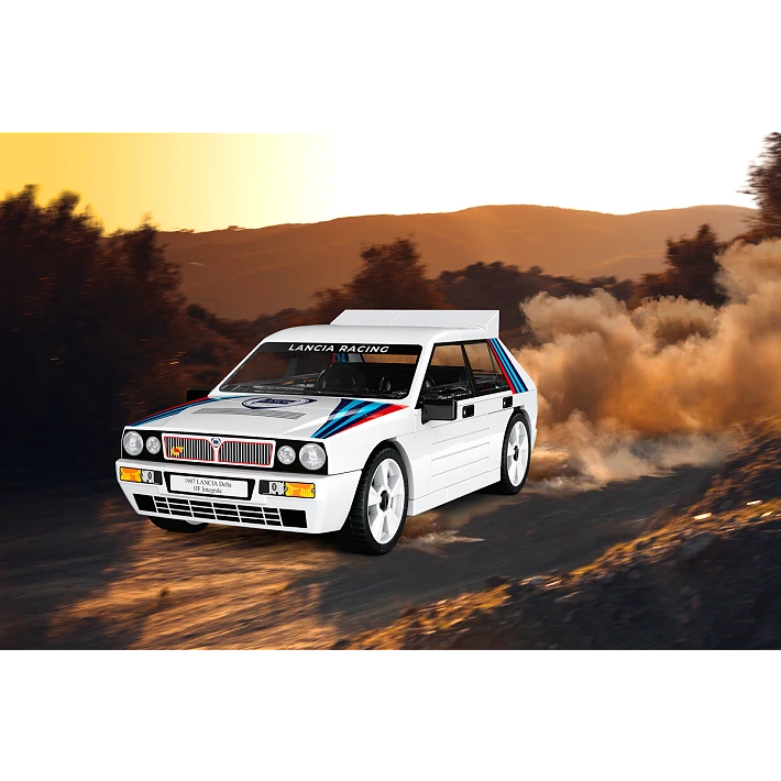 White COBI Lancia Delta HF Integrale model driving through a dusty road scene