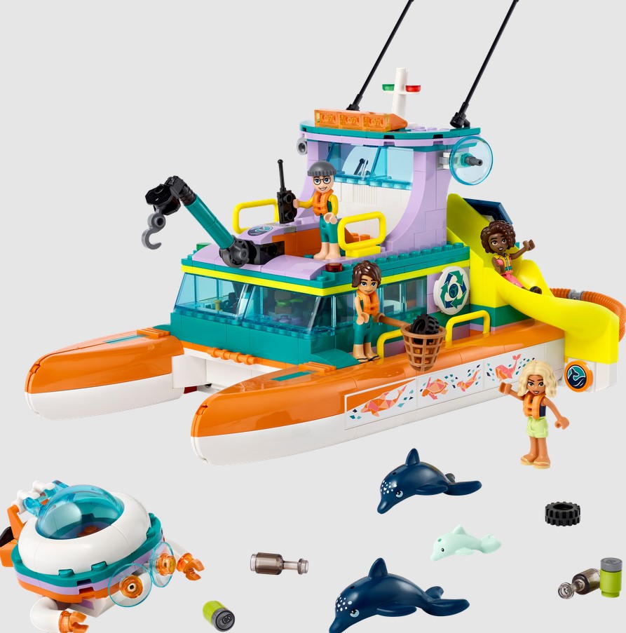 Toy boat set with figures and accessories on a white background