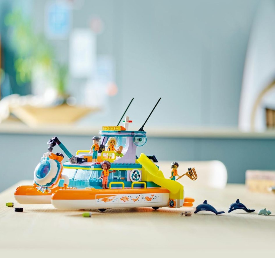 Toy boat with figures on a table with a blurred background