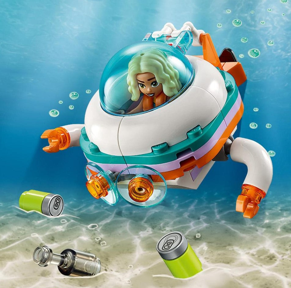 LEGO Friends Sea Rescue Boat 41734Toy underwater vehicle with a character inside, surrounded by water elements on a blue and green background.