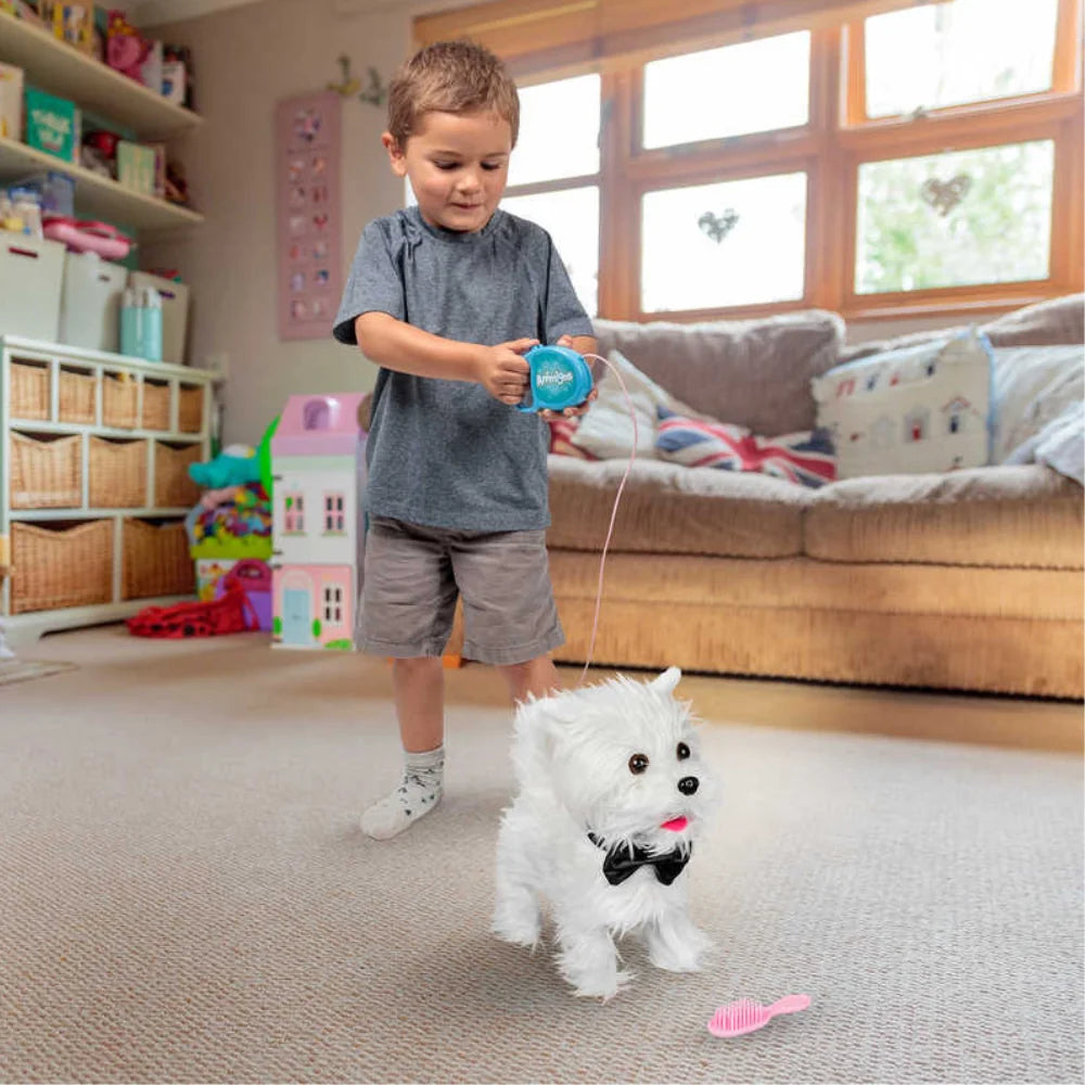 Child playing with Animigos Walking Westie plush dog toy using the remote control lead indoors in Ireland