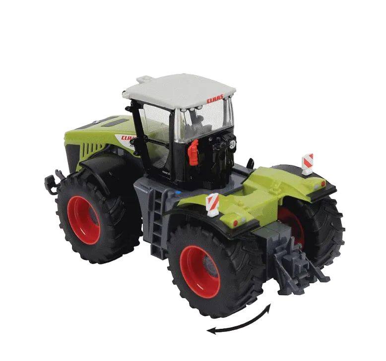 Britains B Claas xerion 5000 shown from a rear angle showing green body colour, black and white cab, red wheels and large black tyres on a white background.