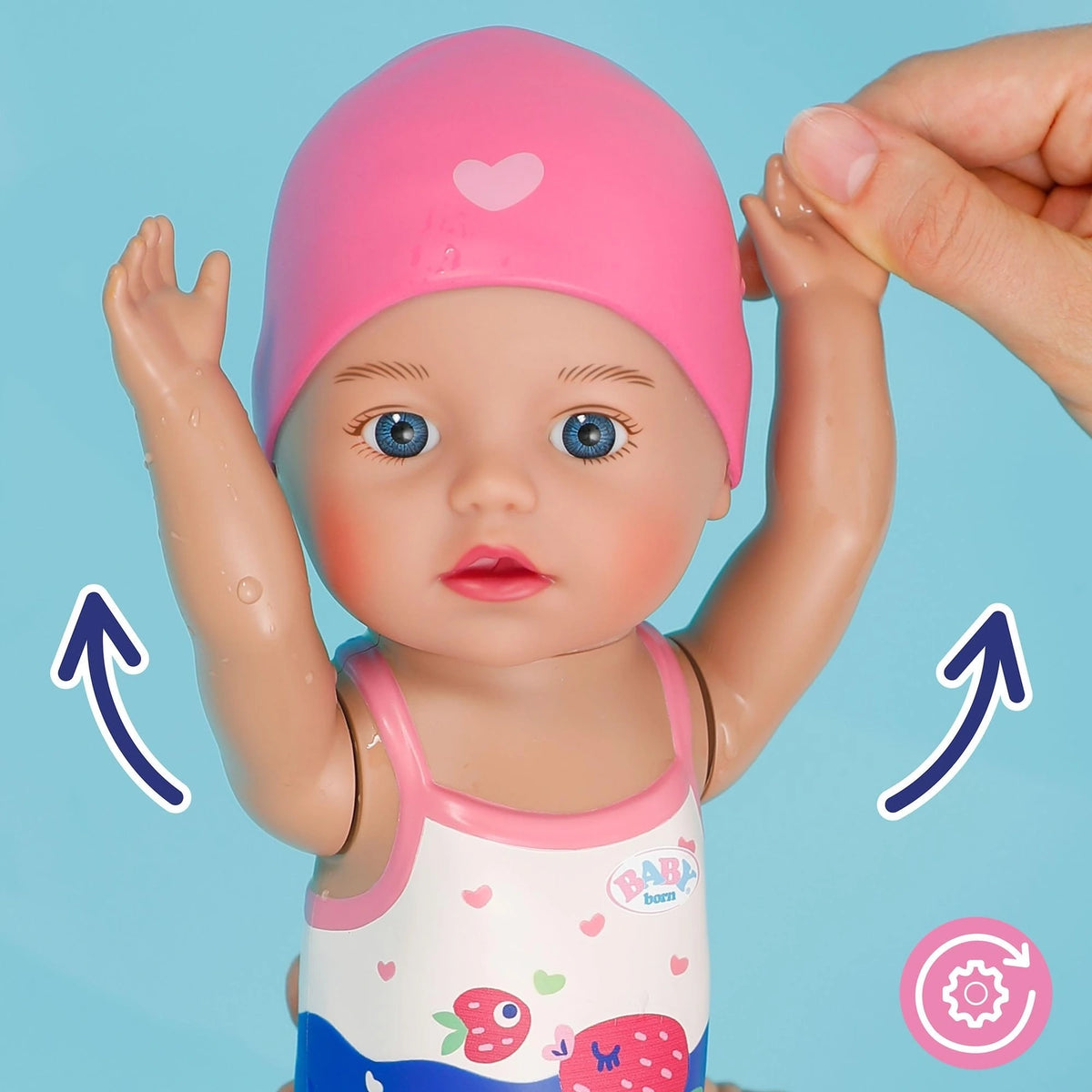 Close view of Baby Born Swimming Lizzie 30cm with both arms raised and movement arrows