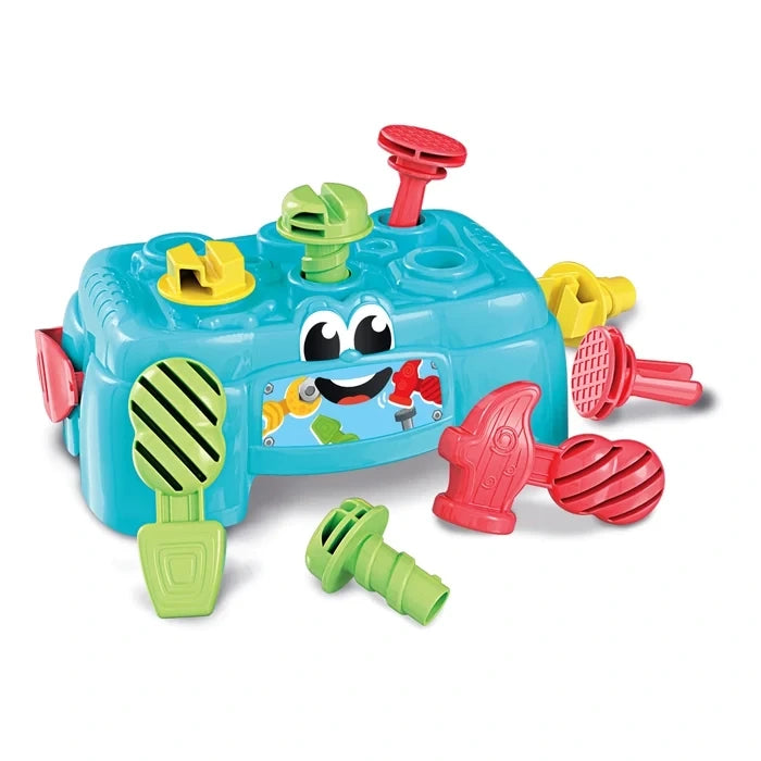 Baby Clementoni turquoise workbench with cartoon eyes, colourful toy hammer, screwdriver, wrench, screws and fastening accessories on a white background.