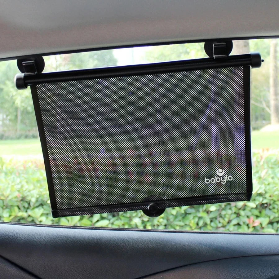 Babylo roller sunshade attached to a car side window inside a vehicle
