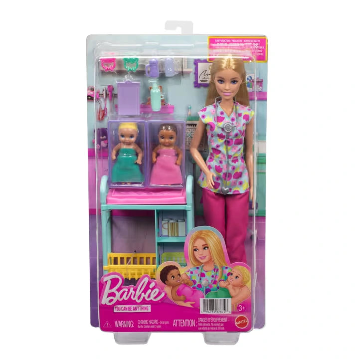 Front of the Barbie Careers Baby Doctor retail packaging showing the blonde doctor doll, two babies wrapped in pink and turquoise blankets, examination trolley, stethoscope, bottles and pacifiers.