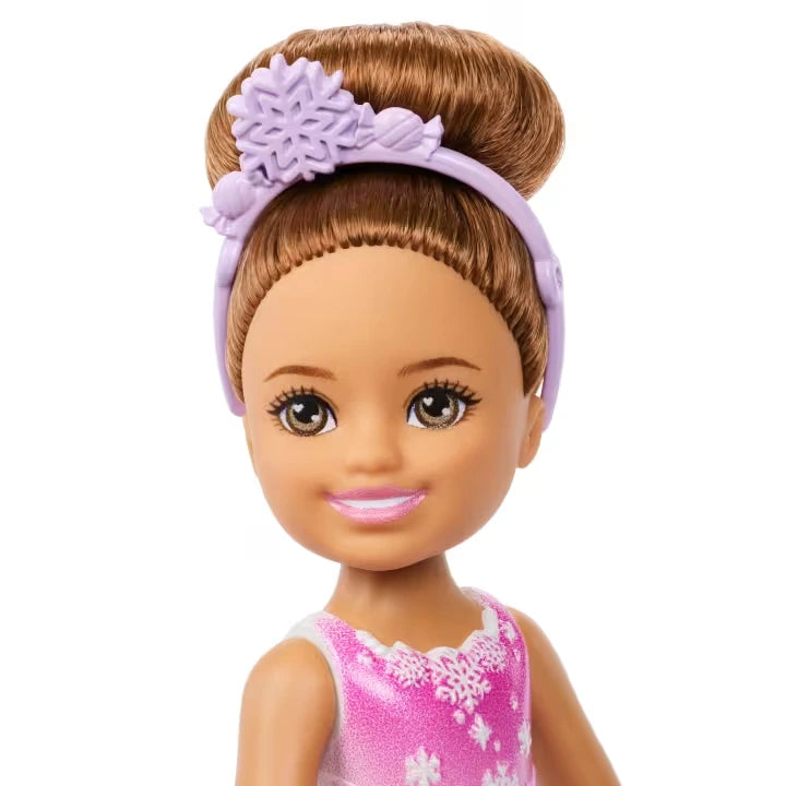 Barbie Chelsea Nutcracker Snow Fairy brunette doll face and purple snowflake headband