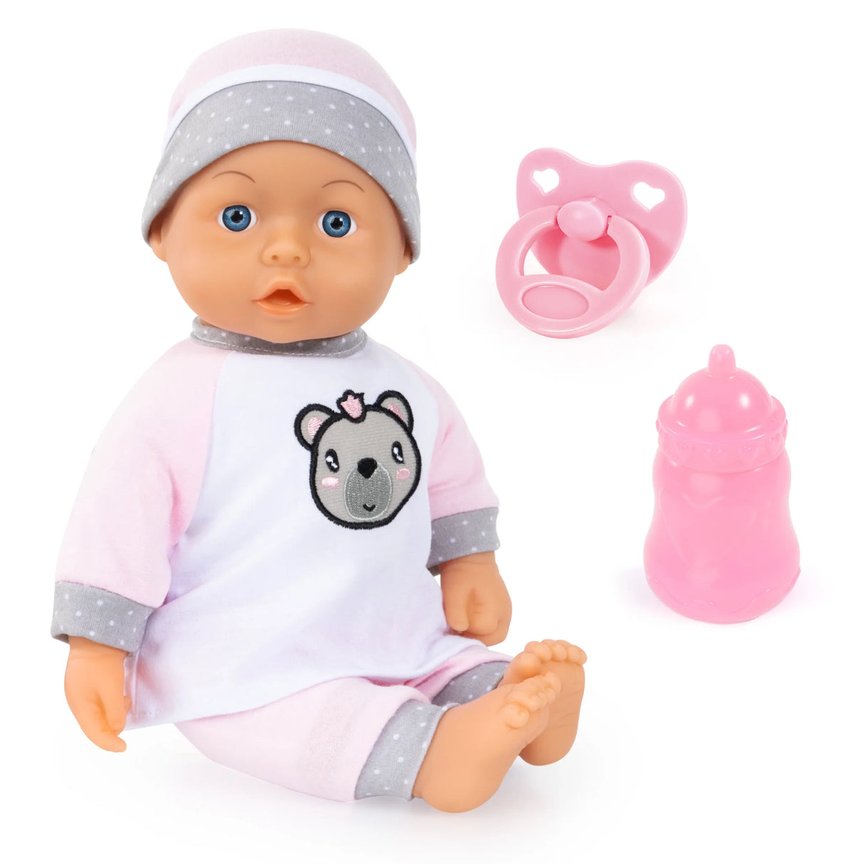 Bayer Kiss Baby Doll in pink outfit with bottle and dummy accessories on white background