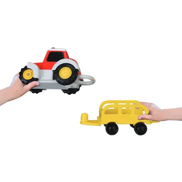 BB Junior farm tractor set showing a red tractor and yellow trailer held apart