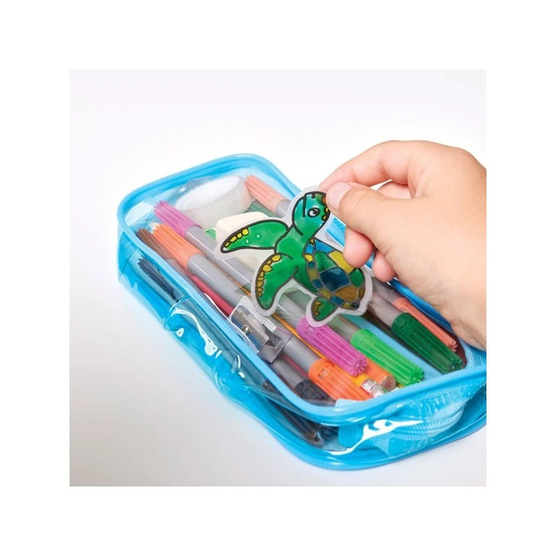 Brainstorm Colour Your Own Stickers Sea Creatures turtle sticker being placed on a blue pencil case