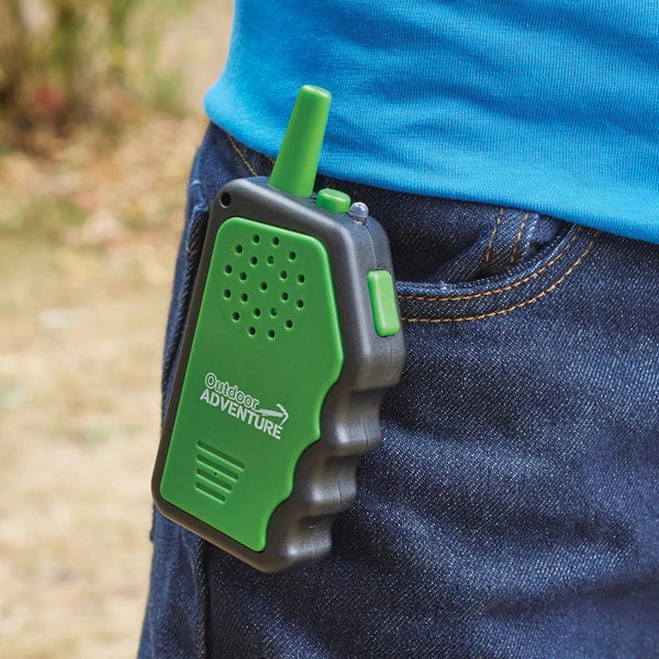 Brainstorm Outdoor Adventure Walkie Talkie clipped to jeans showing green front panel and antenna