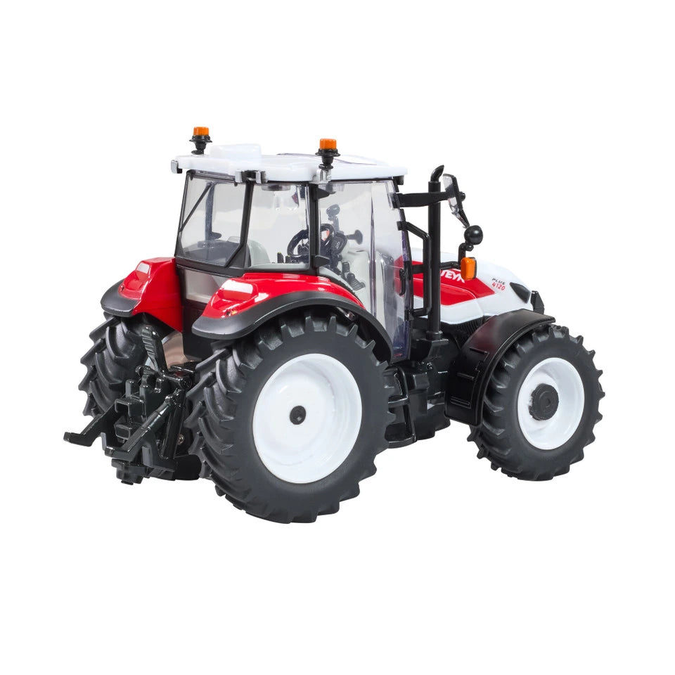 Britains Steyr 4120 Plus farm toy tractor shown side on with white bonnet, red panels and black tyres