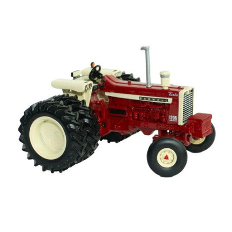 Britains Case IH Farmall 1206 tractor model shown from front left angle with red bodywork, narrow front wheels, rear dual tyres, side engine detailing, exhaust stack and open operator seat