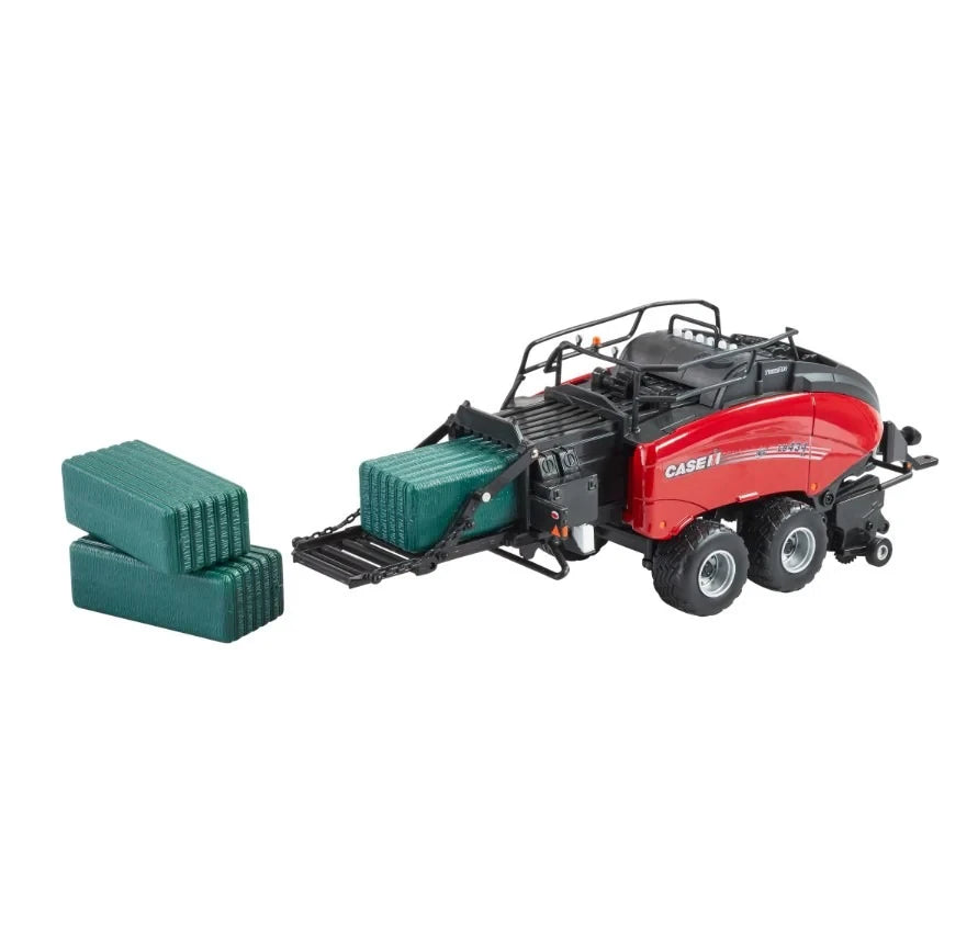 Britains Case IH LB434R XL 1:32 scale baler showing rear bale ejection platform extended with one green rectangular bale on the ejector and two additional green bales stacked nearby