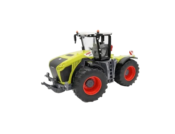 Britains Claas Xerion 5000 1:32 scale green tractor model with red wheels, black tyres and a black rotating cab with a white roof an a white background.