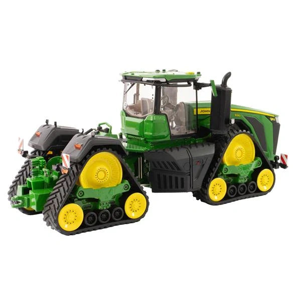 Britains John Deere 9RX 830 model 43399 tractor shown from rear angle with green body, yellow wheels, four track units, cab glazing and rear guard markings