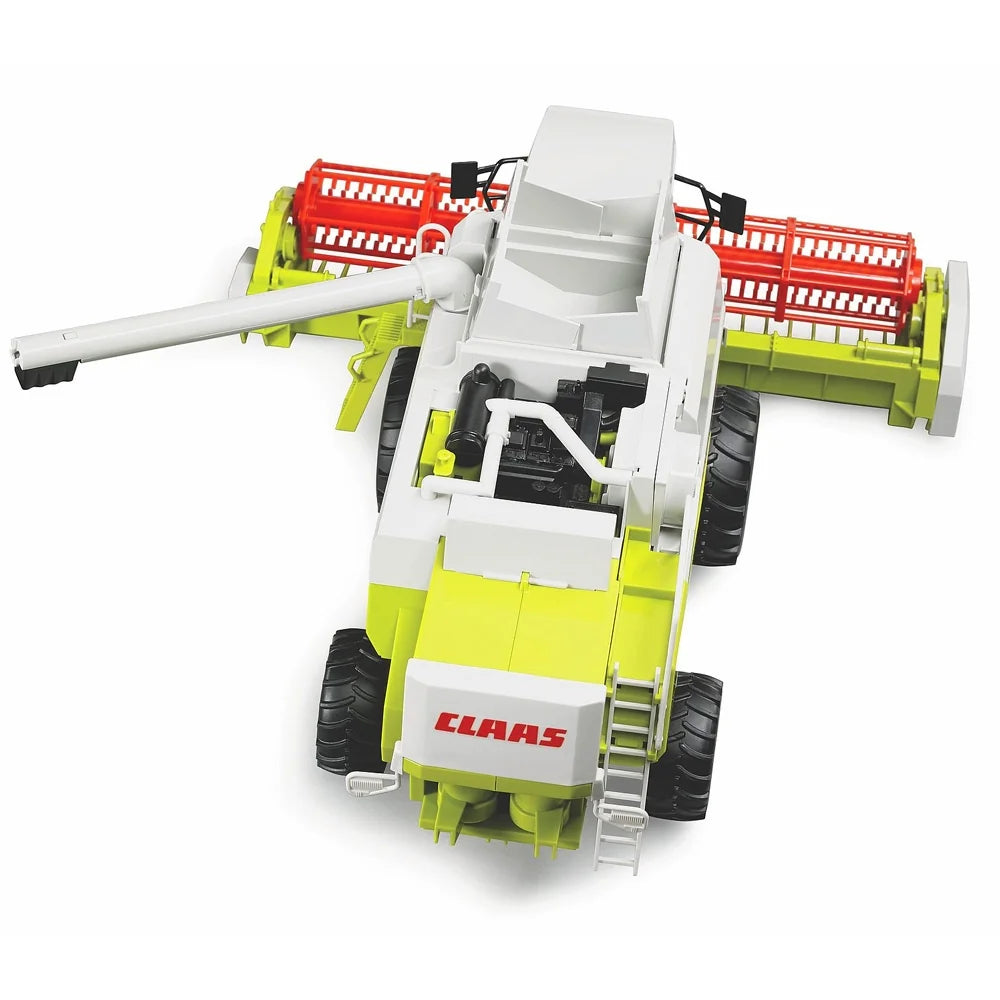 An overhead view of a Bruder Claas Lexion 480 toy combine harvester with green body, red header and large tread wheels.