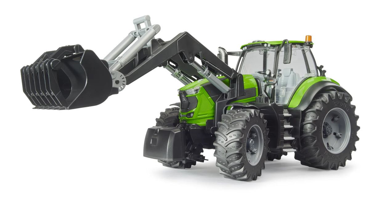 Bruder Deutz 8280 TTV tractor with green cab, black front loader arms, grey wheels and large tread tyres on a white background.