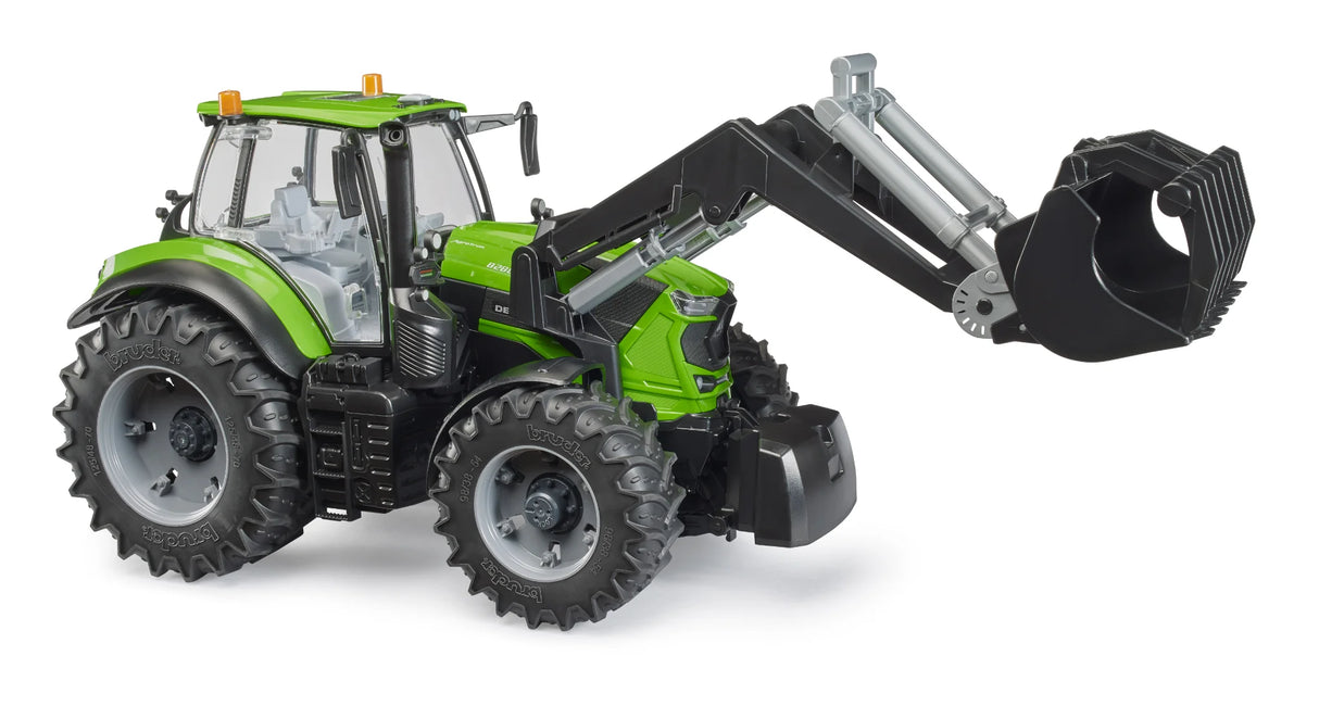 Bruder Deutz 8280 TTV tractor with green body, black front loader and bucket attached, large tread tyres and glazed cab on a white background.