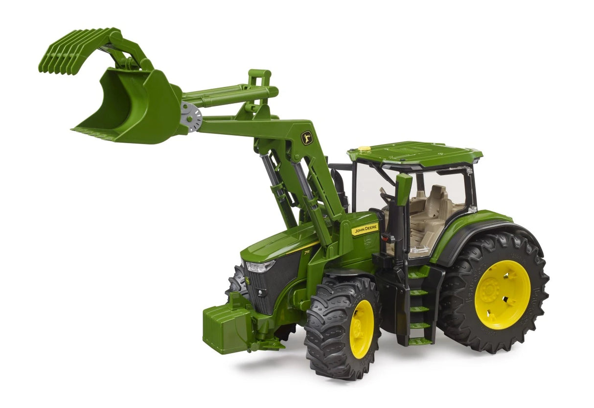Green John Deere 7R 350 farm toy tractor with front loader raised above the cab