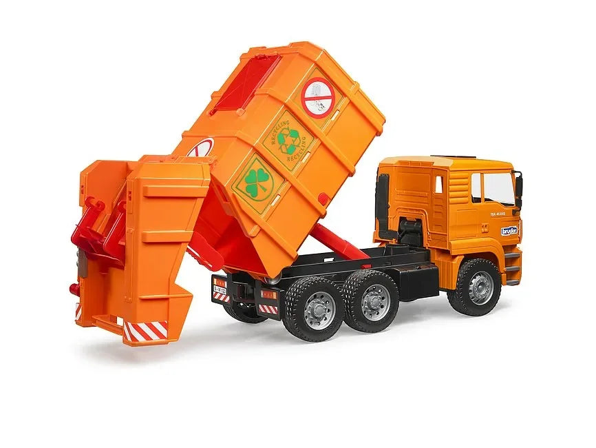 Orange Bruder MAN TGA refuse truck toy with the refuse container raised behind the cab on a white background.