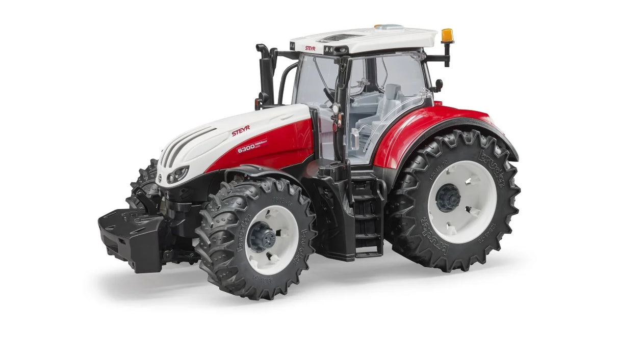 Bruder Steyr 6300 Terrus CVT tractor in red and white with enclosed cab, large tread tyres and front weight block