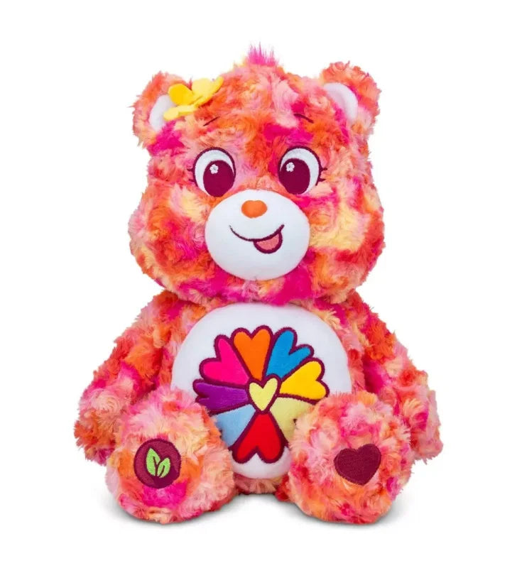 Front view of Care Bears Flower Power Bear 35 cm plush with pink floral fur and heart-flower belly badge in Ireland.