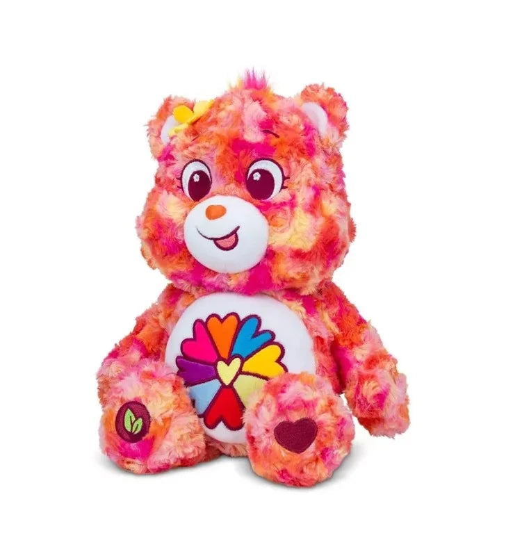 Angle view of Care Bears Flower Power Bear 35 cm plush showing vibrant floral fur and heart-flower badge in Ireland.