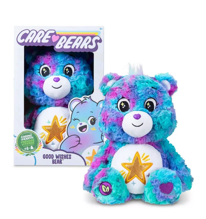 Care Bears Good Wishes Bear 35 cm plush shown in retail box with gold star belly badge and tie-dye fur in Ireland.