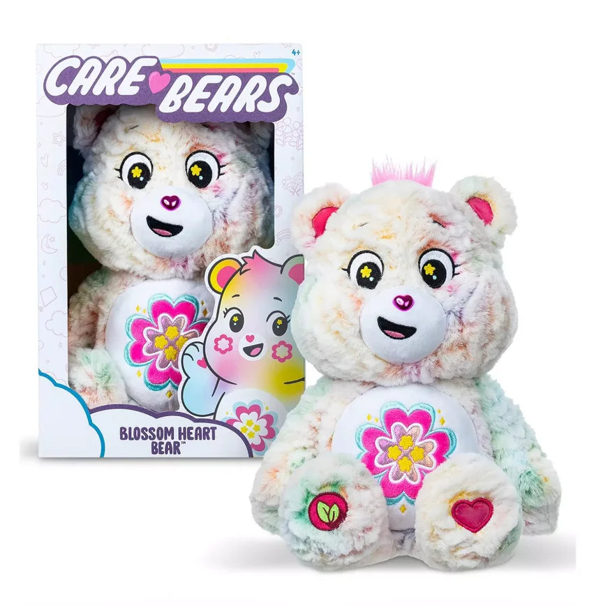Retail packaging of Care Bears Blossom Heart Bear medium plush with character art and product details in Ireland.