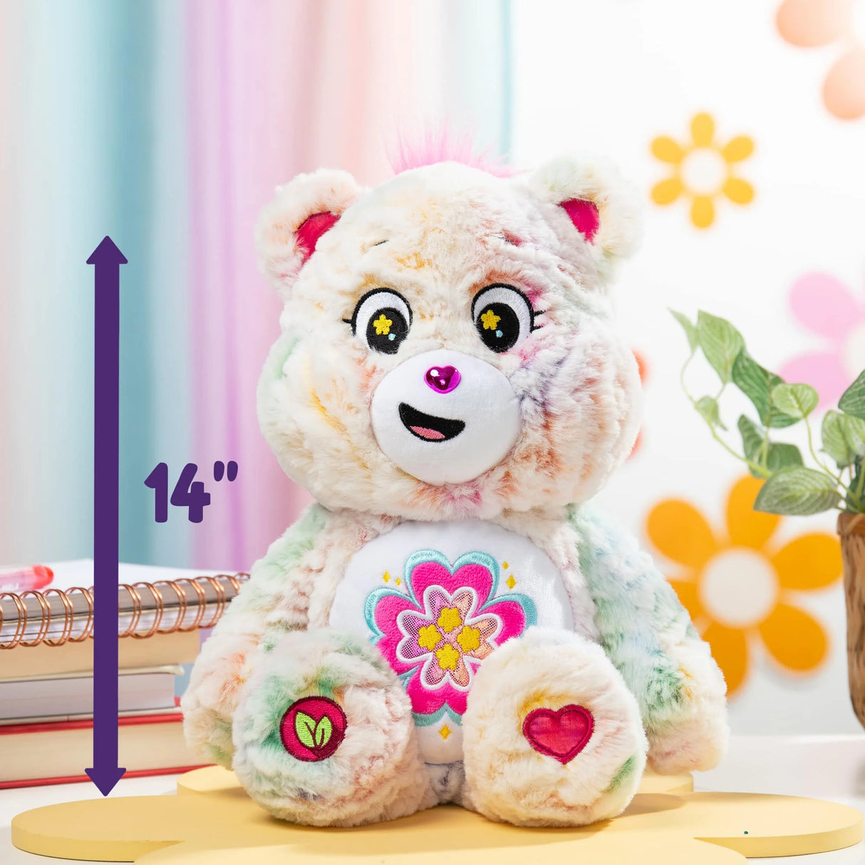 Care Bears Blossom Heart Bear medium plush angled view with multicolour wavy fur and embroidered badge in Ireland.