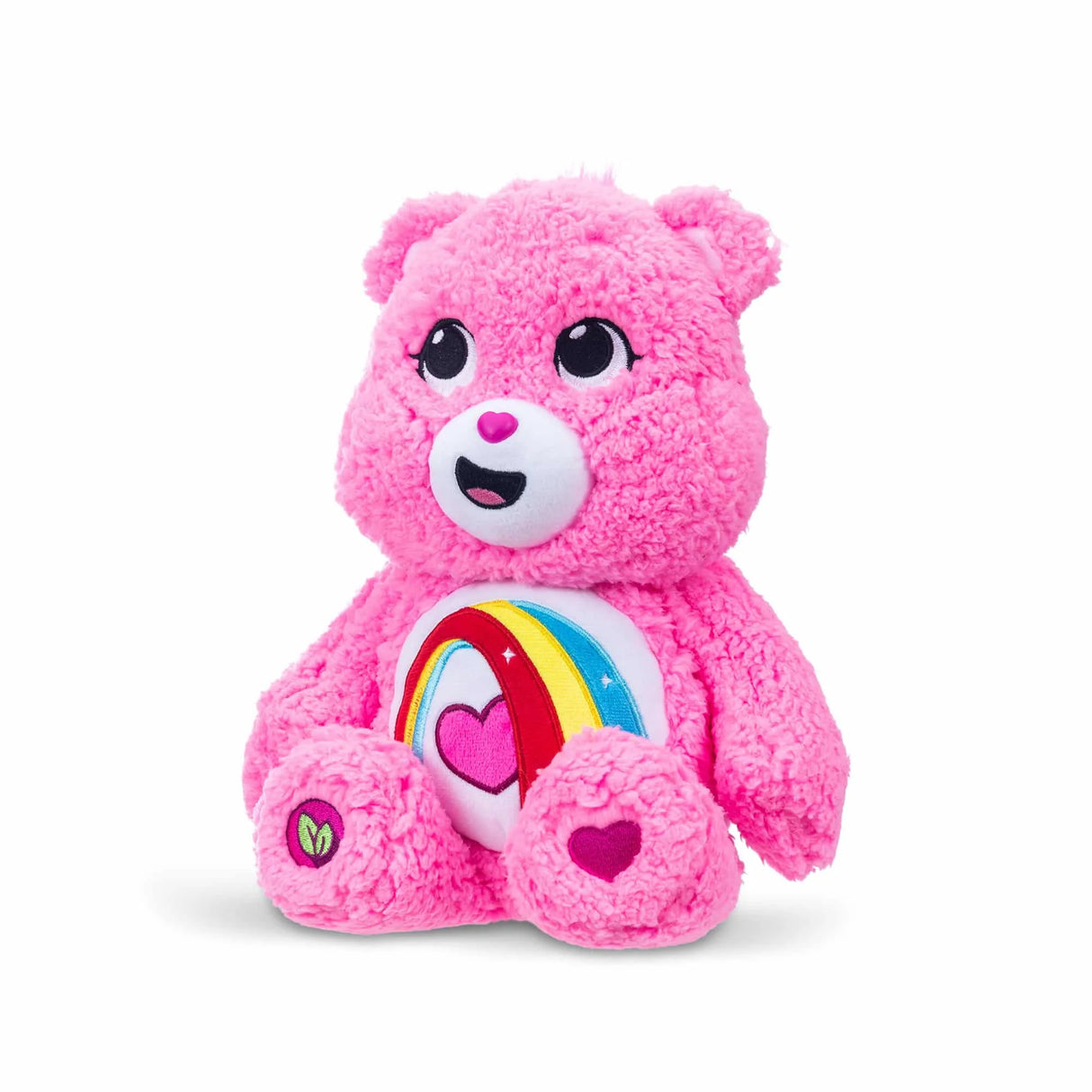 Care Bears Cozy Cheer Bear 14 inch plush angled view highlighting embroidered rainbow heart belly badge in Ireland.