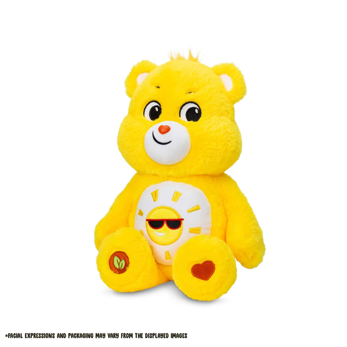 Angled view of Care Bears Medium Plush Funshine Bear highlighting embroidered sun badge and soft texture in Ireland.