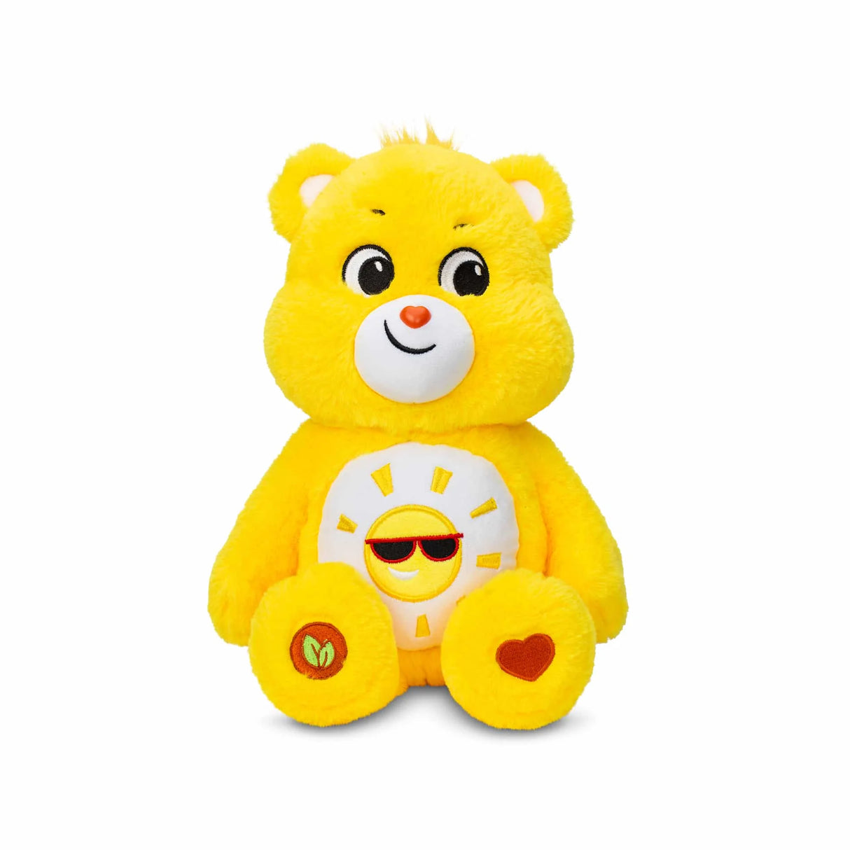 Front view of Care Bears Medium Plush Funshine Bear with bright sun belly badge and eco-friendly tag in Ireland.