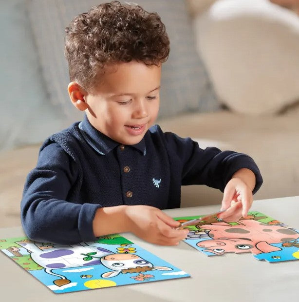 Child assembling Orchard Toys First Farm Friends jigsaw puzzles in Ireland