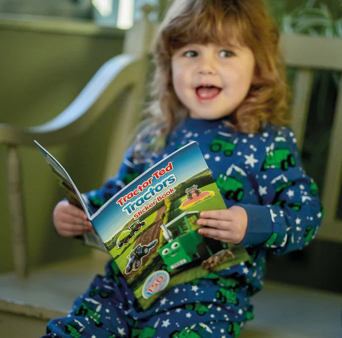 Child enjoying the Tractor Ted Tractors Sticker Book at home – Ireland