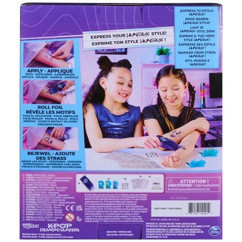 Back of Cool Maker KPop Demon Hunters Shimmer Me Tattoo packaging showing two girls applying tattoos, illustrated application instructions and the included tattoo kit contents.