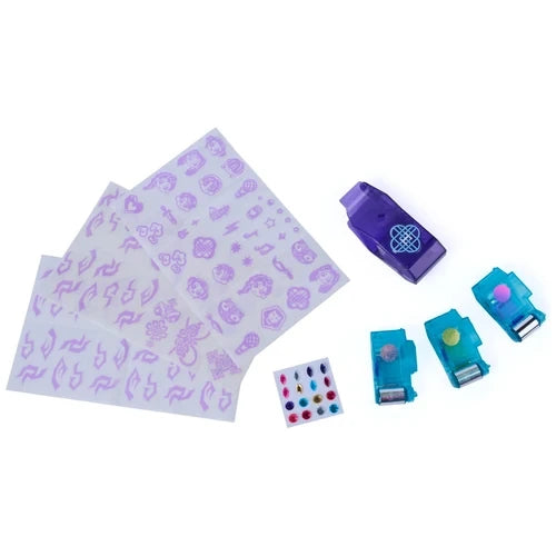 Cool Maker KPop Demon Hunters Shimmer Me Tattoo kit contents arranged on a white background, including two purple tattoo design sheets, HUNTR/X roller, three turquoise foil cartridges and colourful adhesive gems.
