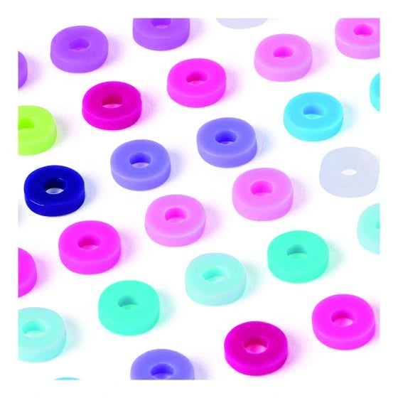 Close-up of loose pink, purple, turquoise, green, blue and white Heishi beads