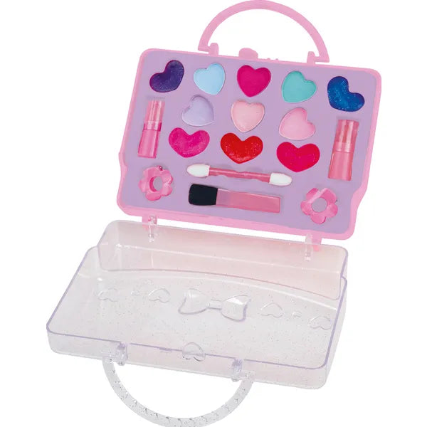 Open pink cosmetic case playset showing heart shaped make up colours, two lipsticks, brush and applicator