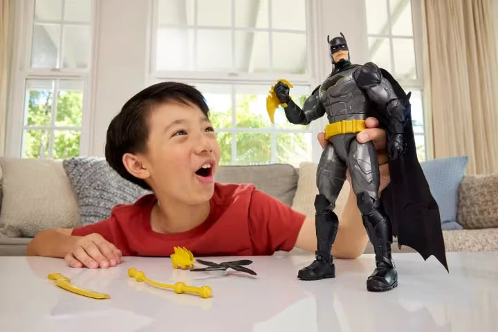 DC Premier Crime Crusher Batman standing with weapons beside a child at a table