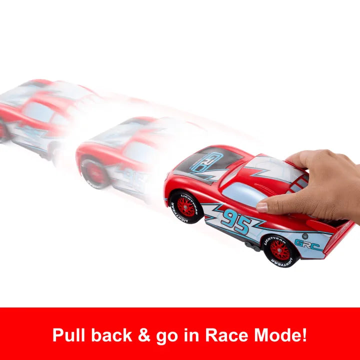 Disney Cars Drift & Race Lightning McQueen toy car in pull-back racing motion with red blur effect.