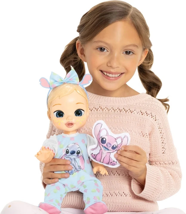 Child holding the Disney Darlings Stitch Blonde Doll and pink character cushion