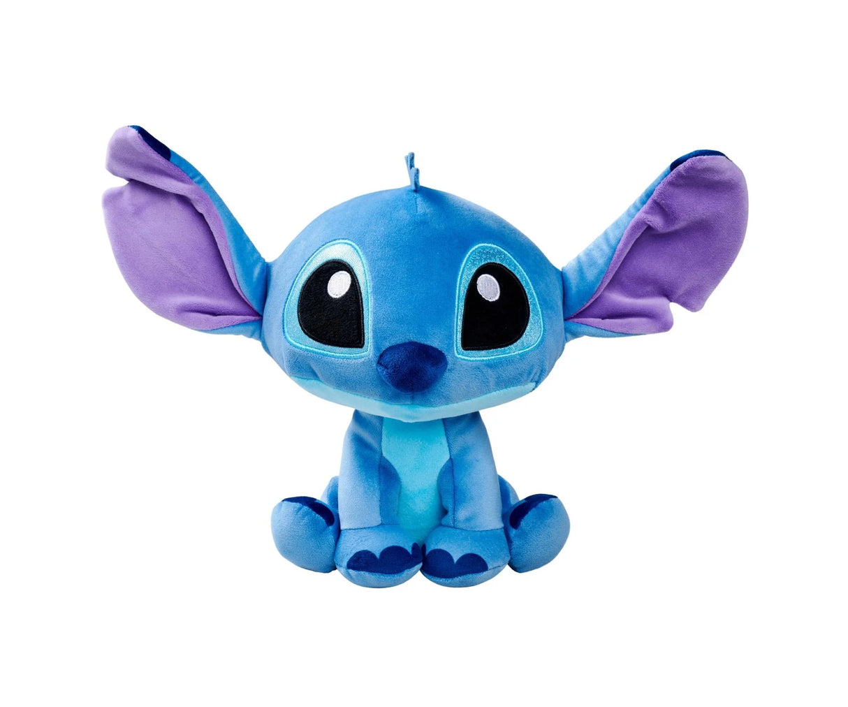 Front view of Disney Doorables Stitch plush toy with large glittery eyes and wide purple ears sitting upright on white background