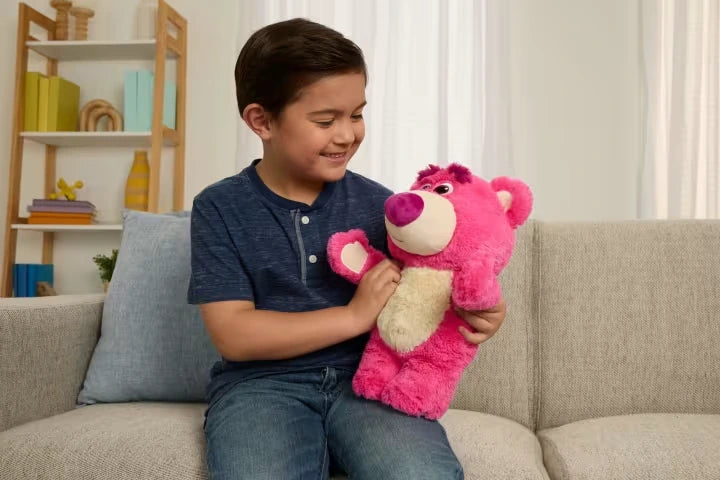 Disney Pixar Toy Story 30th Anniversary Lotso Feature Plush on a sofa with a child