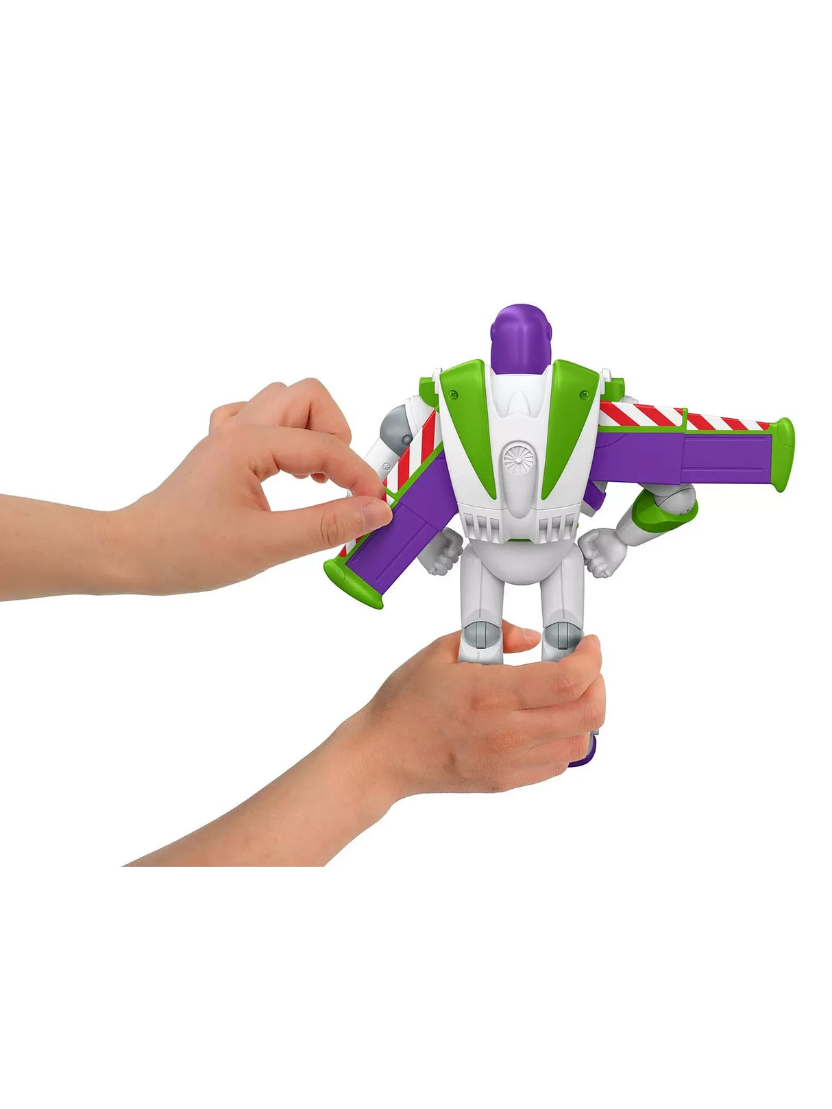 Hands pressing the back button on Disney Pixar Toy Story 5 Buzz Lightyear figure with wings open