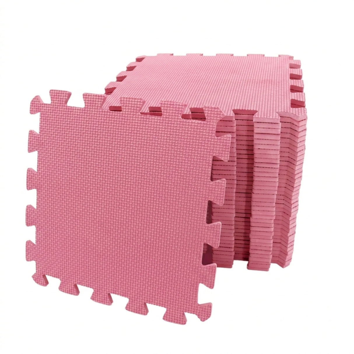 Stack of pink interlocking EVA foam play mats with one tile positioned in front showing textured surface and puzzle edge design