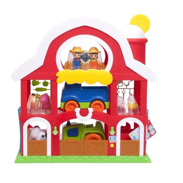 Farm house toy with lights and sound featuring farmers, tractor, and animals inside colorful barn