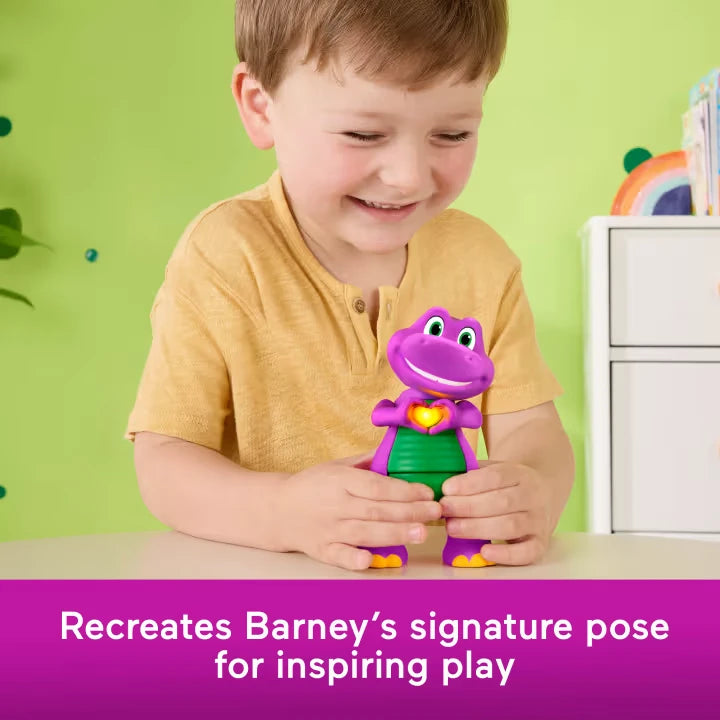 Child playing with Fisher-Price Barney's World Heart Hands Barney figure